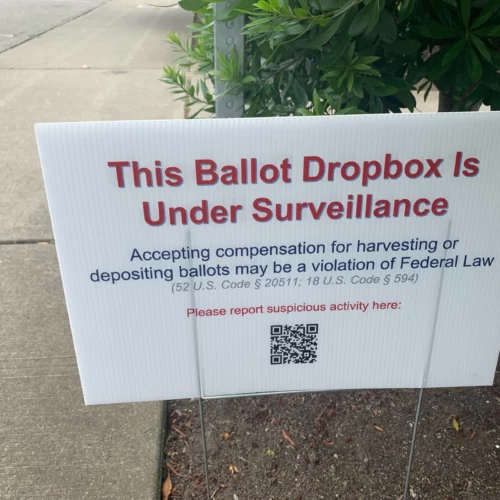 Signs like this one at the Broadview library branch in north Seattle popped up at some King County ballot drop boxes in July. They prompted concerns about voter intimidation and ultimately an investigation by the King County Sheriff's Office.