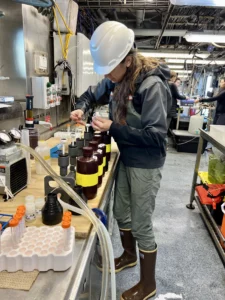 Anna Bolm collects eDNA samples aboard NOAA's Bell M. Shimada. On the May 6-17 trip, scientists collected around 65 eDNA samples for research oceanographer Nick Adams