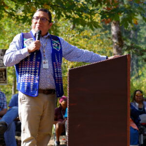 man in blue speaking