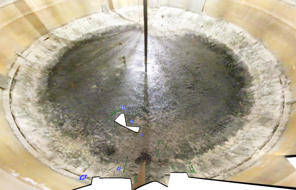 The salty grey top of an underground tank is pictured with labels of several leaks. 