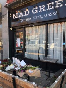 Restaurant Mad Greek and flowers left for the victims of homicide who worked at the restaurant. 