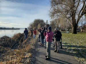 a group of people with cameras taking photos