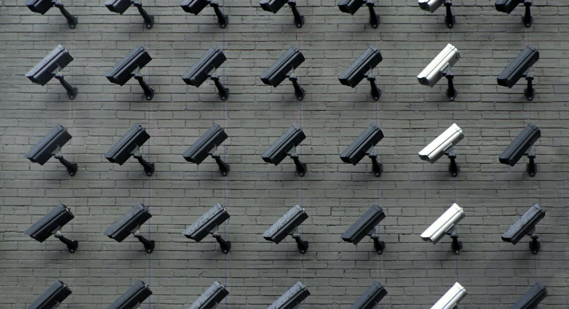 Varying security cameras lined up. A growing number of privacy concerns are being raised about automated tracking and data sharing and storing, locally and nationwide. Photo by Lianhao Qu via Unsplash.