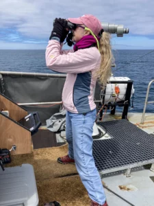 Dr. Lisa Ballance surveys for marine mammals and seabirds during an August research cruise.