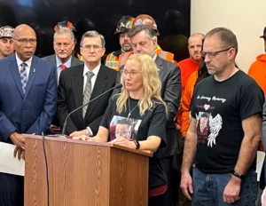 Grieving mother Amber Weilert and her husband, right, urged passage of new traffic safety legislation at a packed press conference in Olympia on January 26
