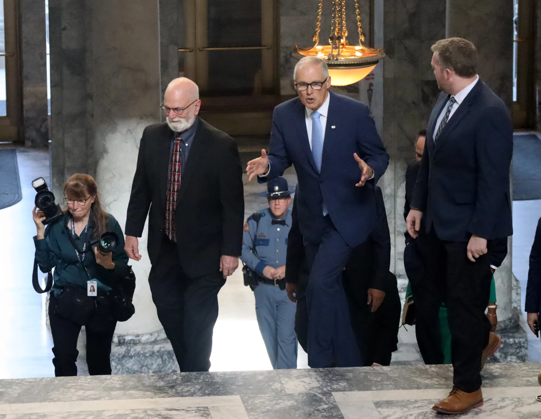 Washington Gov. Jay Inslee walks through the Capitol building in Olympia, en route to deliver his annual State of the State address, Jan. 10, 2023