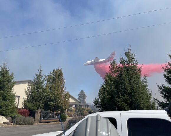 Aerial firefighting crews drop fire retardant on a fire outside of Spokane in 2022. Photo by Jay Wilkins.