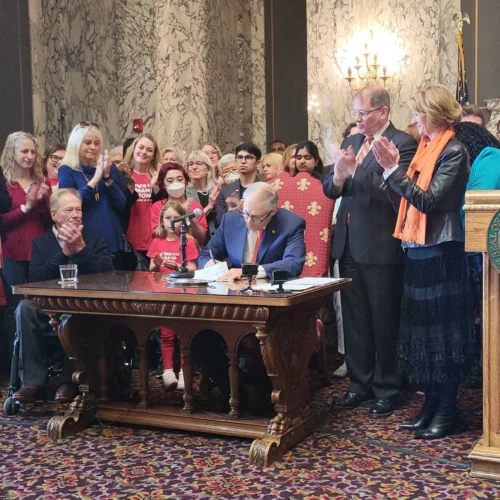 Washington Gov. Jay Inslee signed three new gun bills into law Tuesday, including an assault weapons ban that takes immediate effect