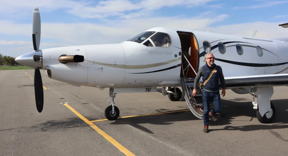 KinectAir CEO Jonathan Evans disembarks from a Pilatus PC-12 aircraft in Kalispell after joining a customer's flight from Vancouver, Washington