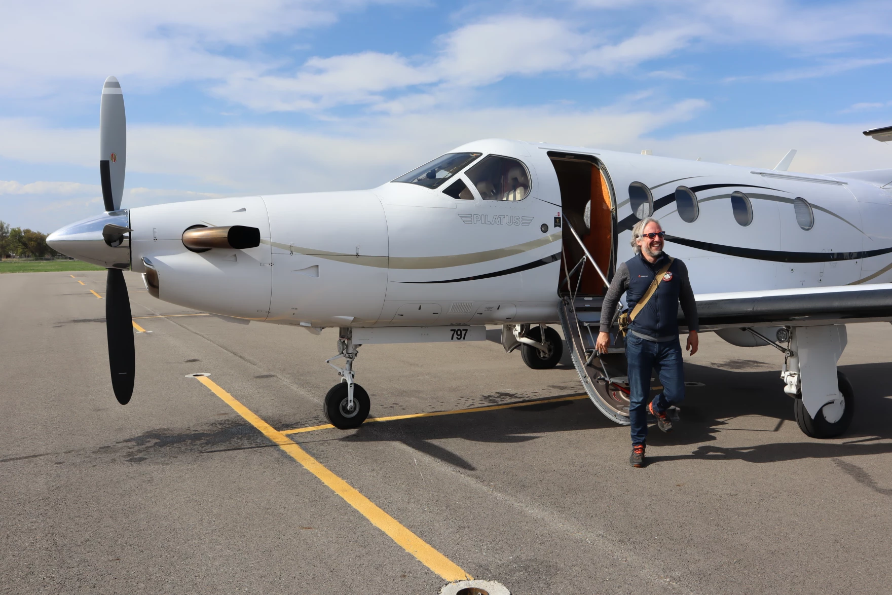 KinectAir CEO Jonathan Evans disembarks from a Pilatus PC-12 aircraft in Kalispell after joining a customer's flight from Vancouver, Washington