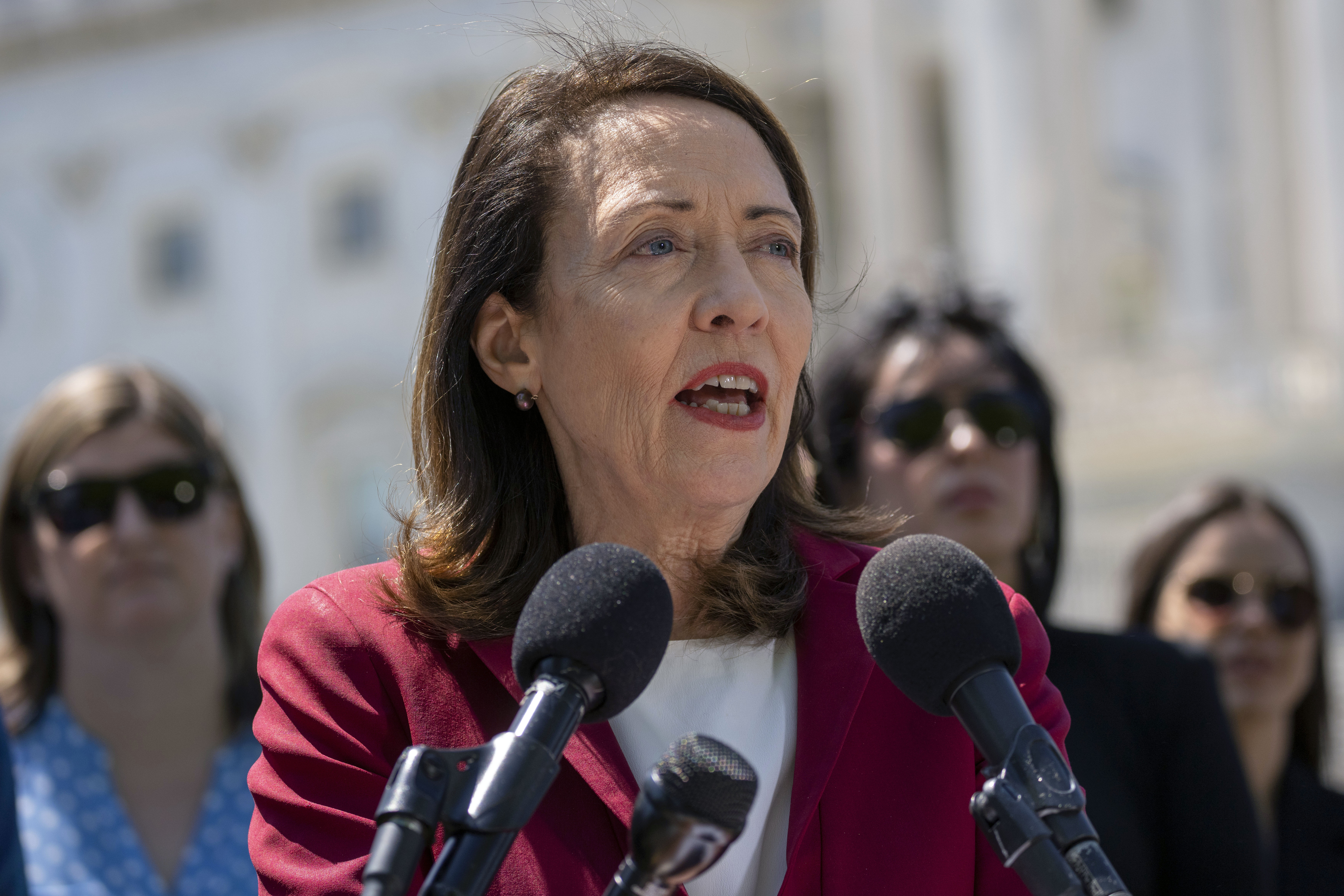 Portrait of Senator Maria Cantwell. She is wearing red jacket. 