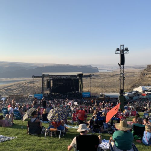 Near sunset at the Gorge Amphitheater, the Columbia River rolls at the back hip of the mainstage, while Dave Matthews plays last summer