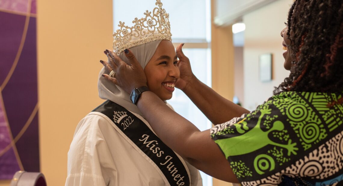 Miss Juneteenth Queen Razan Osman has a crown placed on her head by pageant director Elouise Sparks