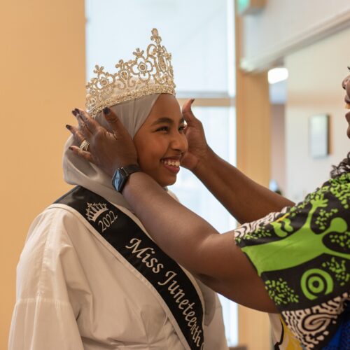 Miss Juneteenth Queen Razan Osman has a crown placed on her head by pageant director Elouise Sparks