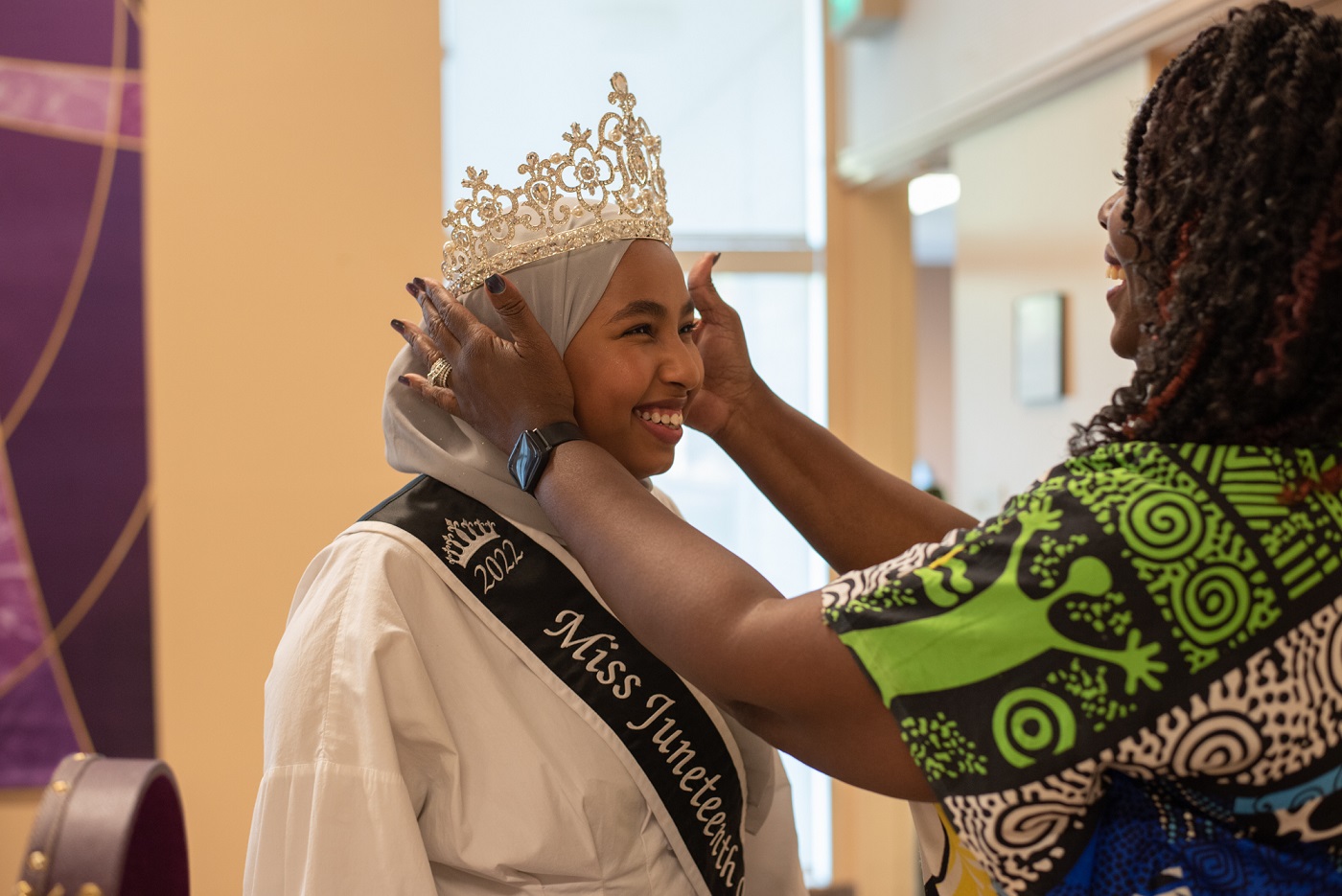 Miss Juneteenth Queen Razan Osman has a crown placed on her head by pageant director Elouise Sparks