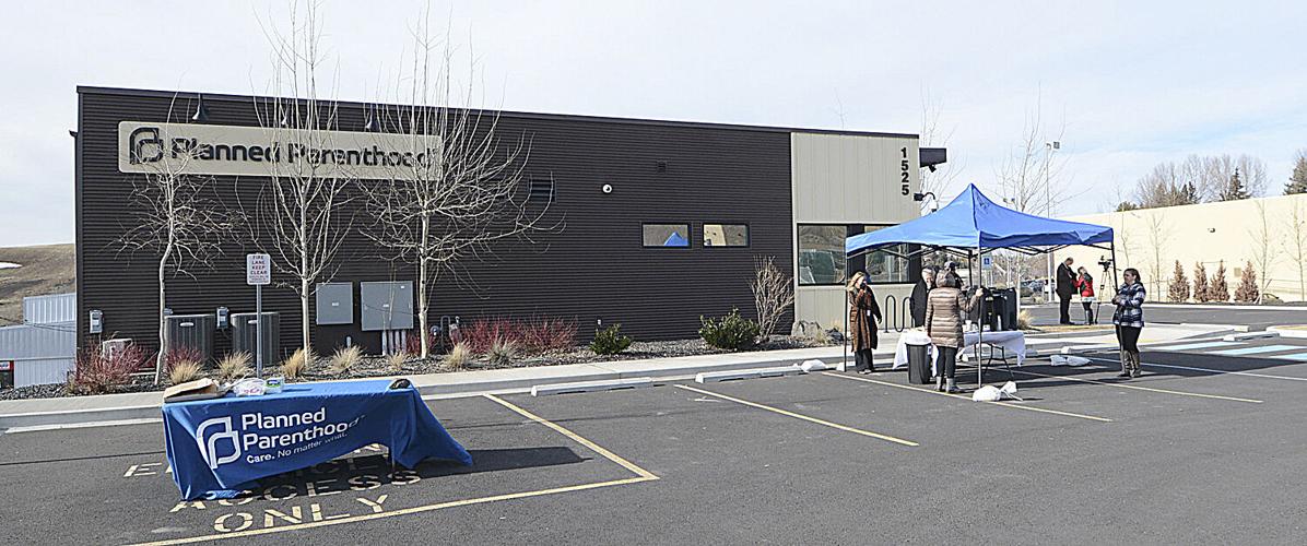 People stand outside the Pullman Planned Parenthood building during 2016. The clinic has seen an increase in patients from Idaho seeking abortions in recent months, following the passage of laws that have curtailed abortion in Idaho. (Credit: The Lewiston Tribune)