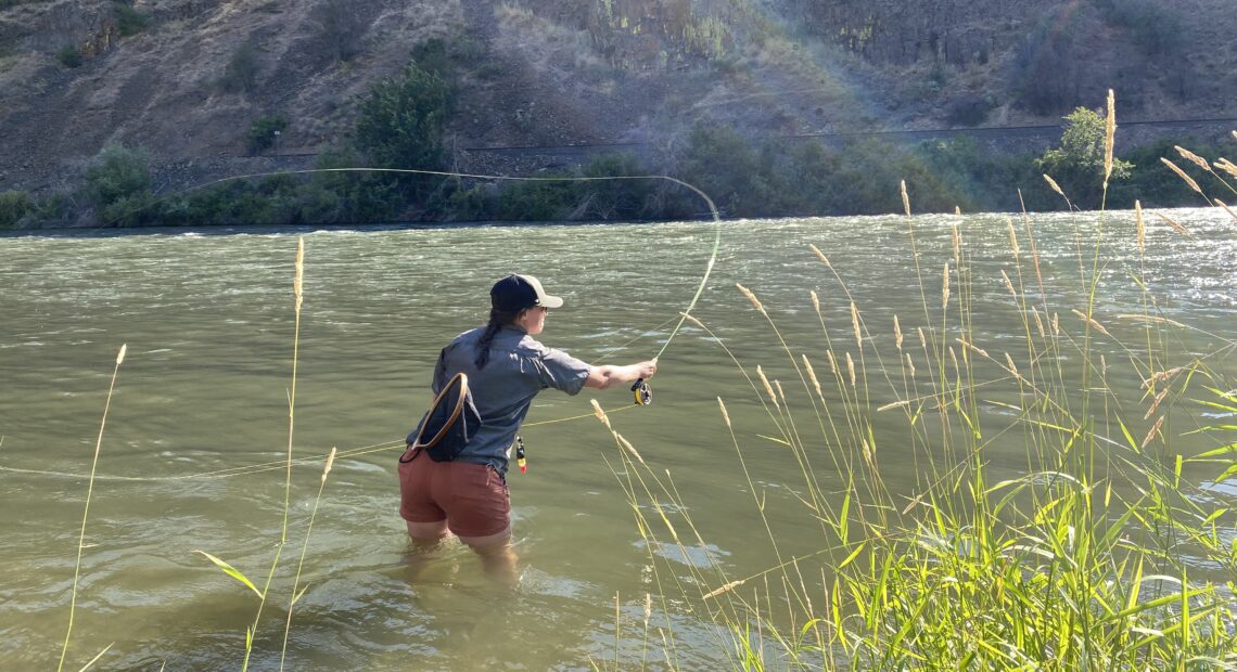 Ashtyn Harris of Ellensburg fishes the Yakima River Canyon using a type of caddis dry fly. Although sometimes annoying, the caddisflies are excellent food for fish and fowl