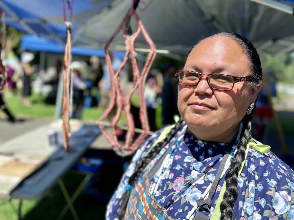  Yakama Nation member Elaine Harvey demonstrated how to filet lamprey and hang it to dry for jerky. (Credit: Courtney Flatt.)