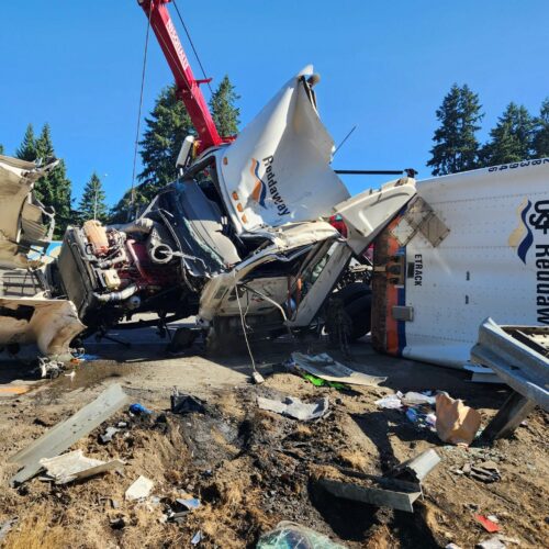 A crane had to be used to life the semi-truck, which was heavy with cargo. // Credit: WSDOT Tacoma, @wsdot_tacoma on Twitter