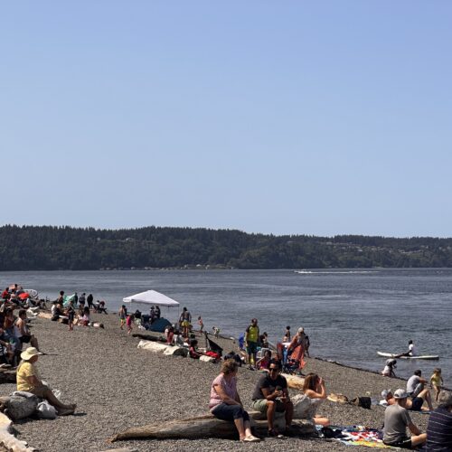 Beachgoers stay cool Monday afternoon at Owen Beach in Tacoma. (Credit: Lauren Gallup NWPB)