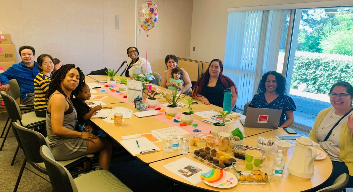 Attendees of Pan con Café sit with Blanca Sagastizado during a spring meeting. (Credit: Claudia Miller)