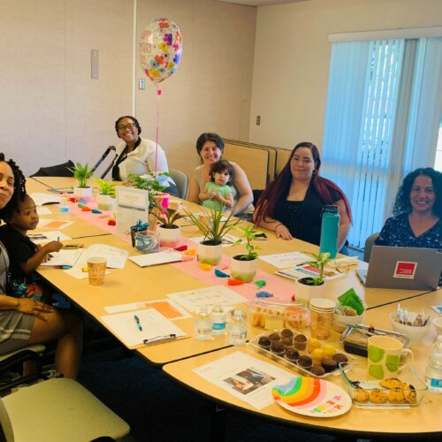 Attendees of Pan con Café sit with Blanca Sagastizado during a spring meeting. (Credit: Claudia Miller)