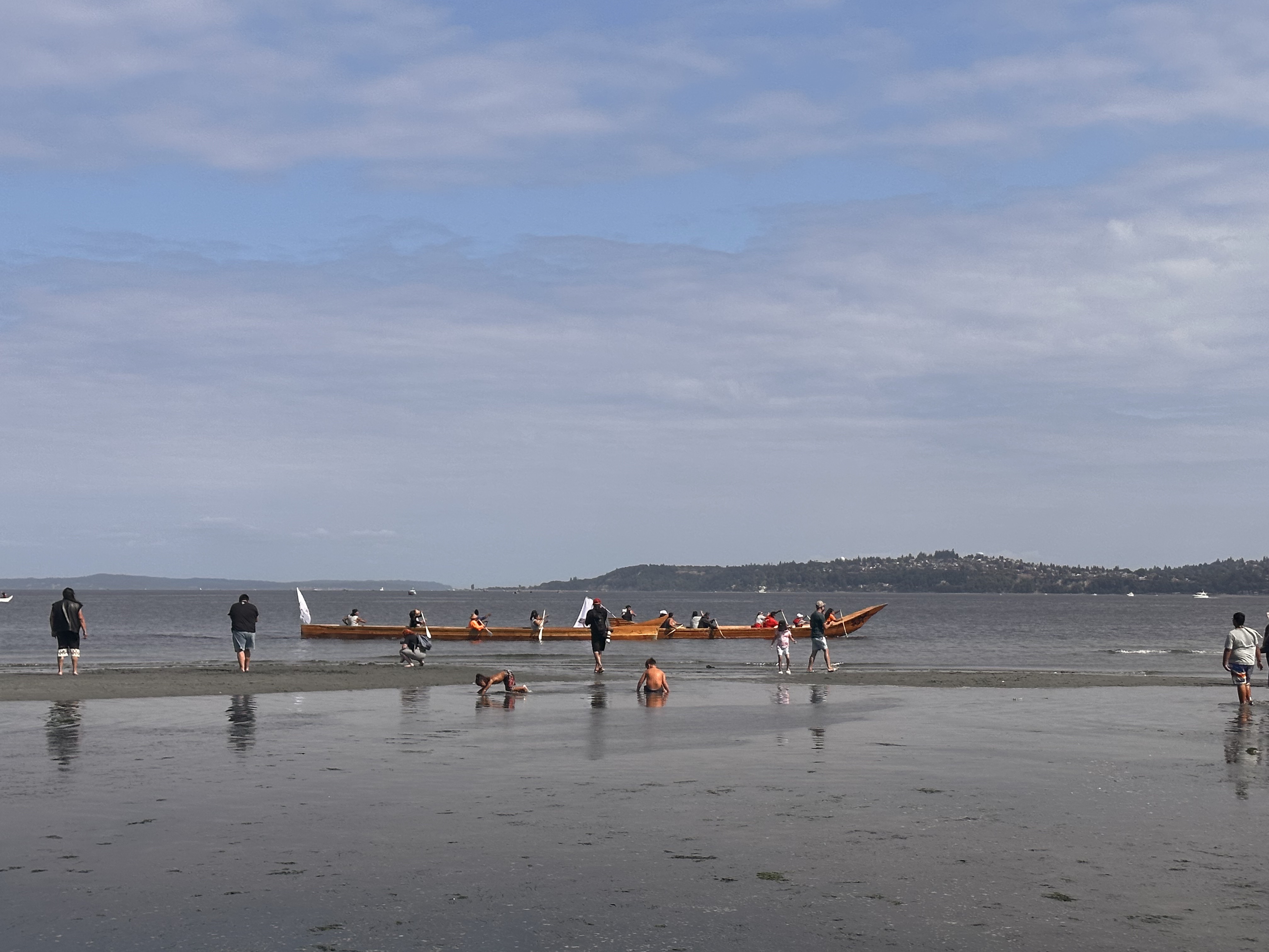 A moment of stillness and quite as one canoe paddles in at Alki Beach. // CREDIT: Tracci Dial, NWPB
