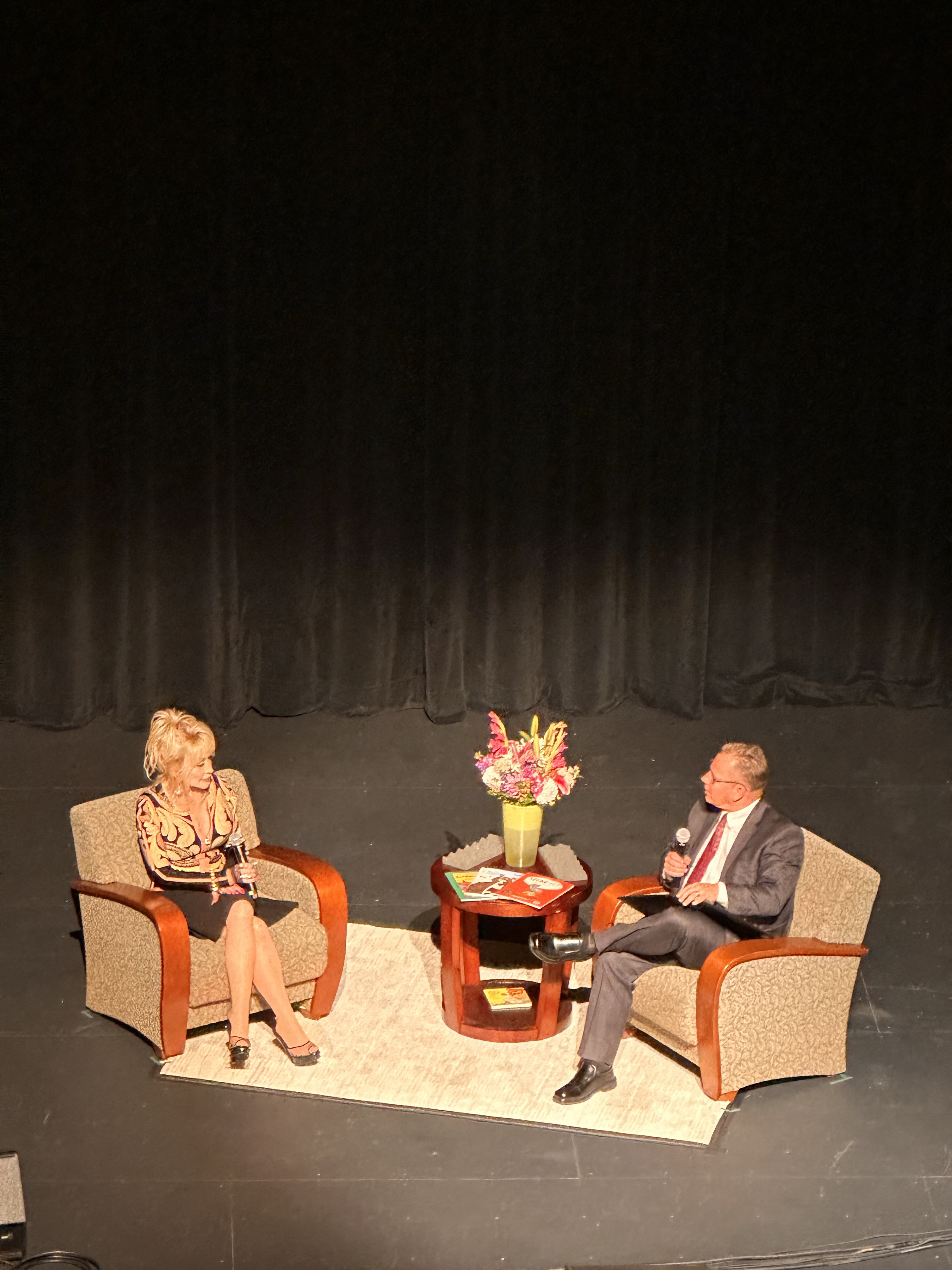 State Superintendent, Chris Reykdahl, asked Dolly Parton questions about her career, love of reading and passion for early education. CREDIT: Lauren Gallup, NWPB