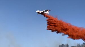 A Very Large Air Tanker dropping retardant on the Eagle Bluff Fire, burning in Okanogan County. // Credit: InciWeb