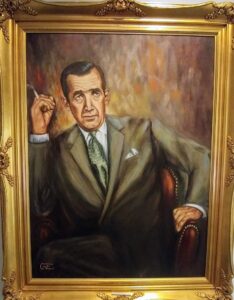 Portrait painting of Edward R Murrow with a golden frame