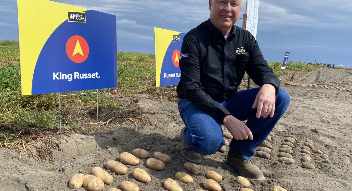 Ken Luke, a manager with McCain Foods, shows off some of the old standby potato varieties, along with some of the new, like the fresh “King Russet,” at a recent field day in Quincy.