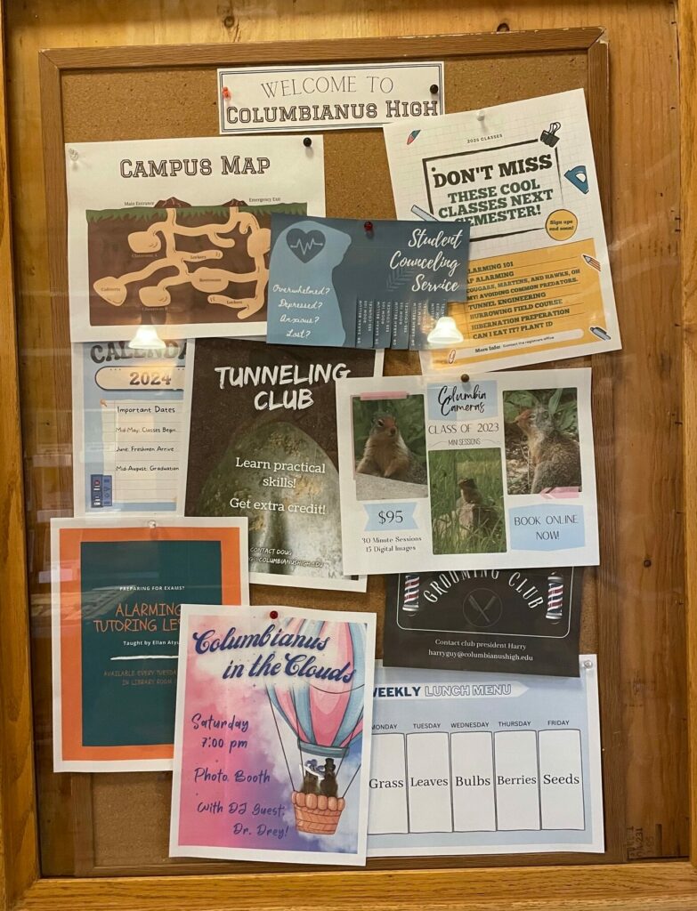 A brown board shows posters with photography packages, classes and a tunnel campus map for the fictional ground squirrel high school.