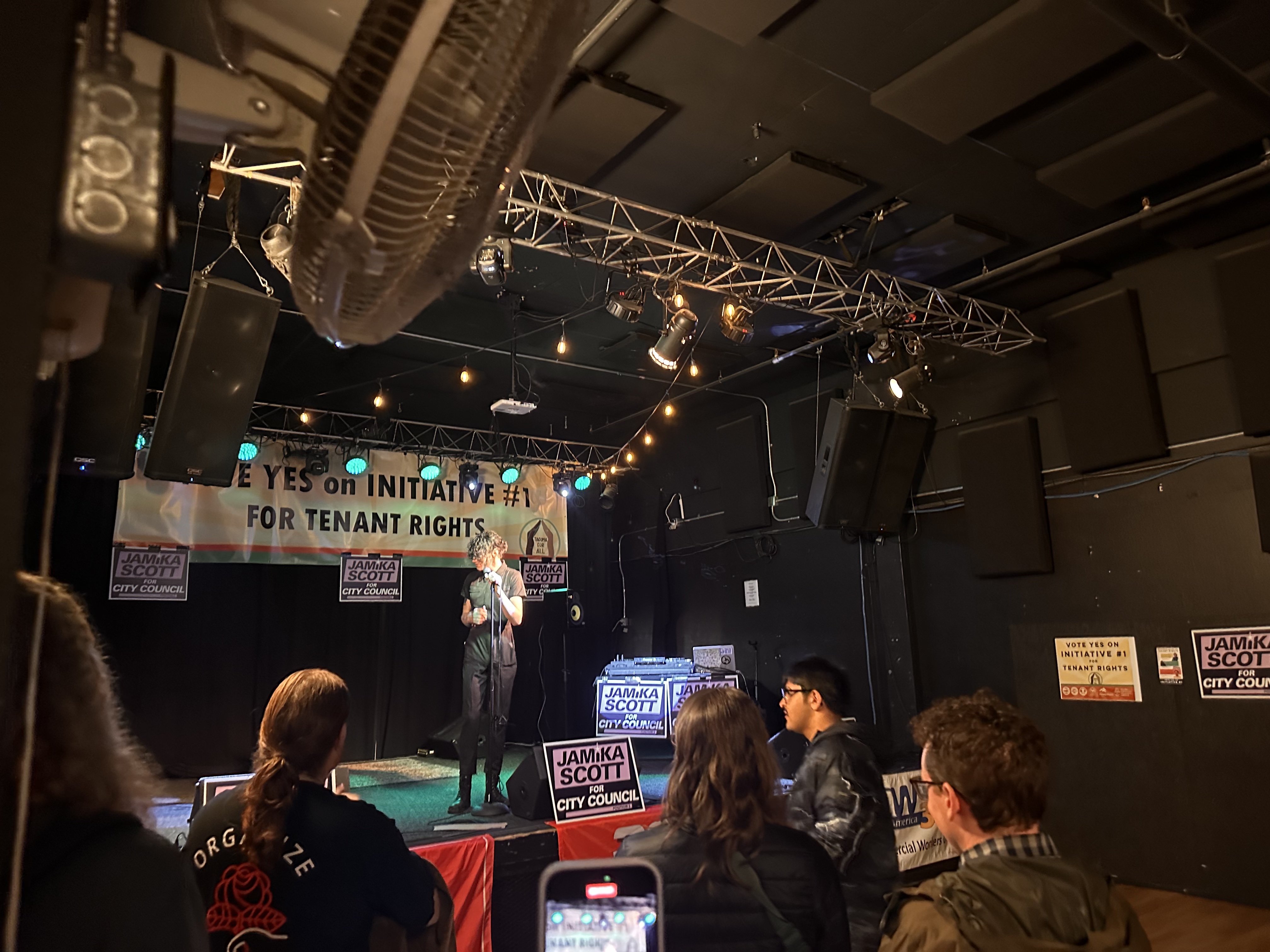 Zev Cook prepares to address the crowd of supporters gathered at Real Art Tacoma on election night. (Credit: Lauren Gallup / NWPB)