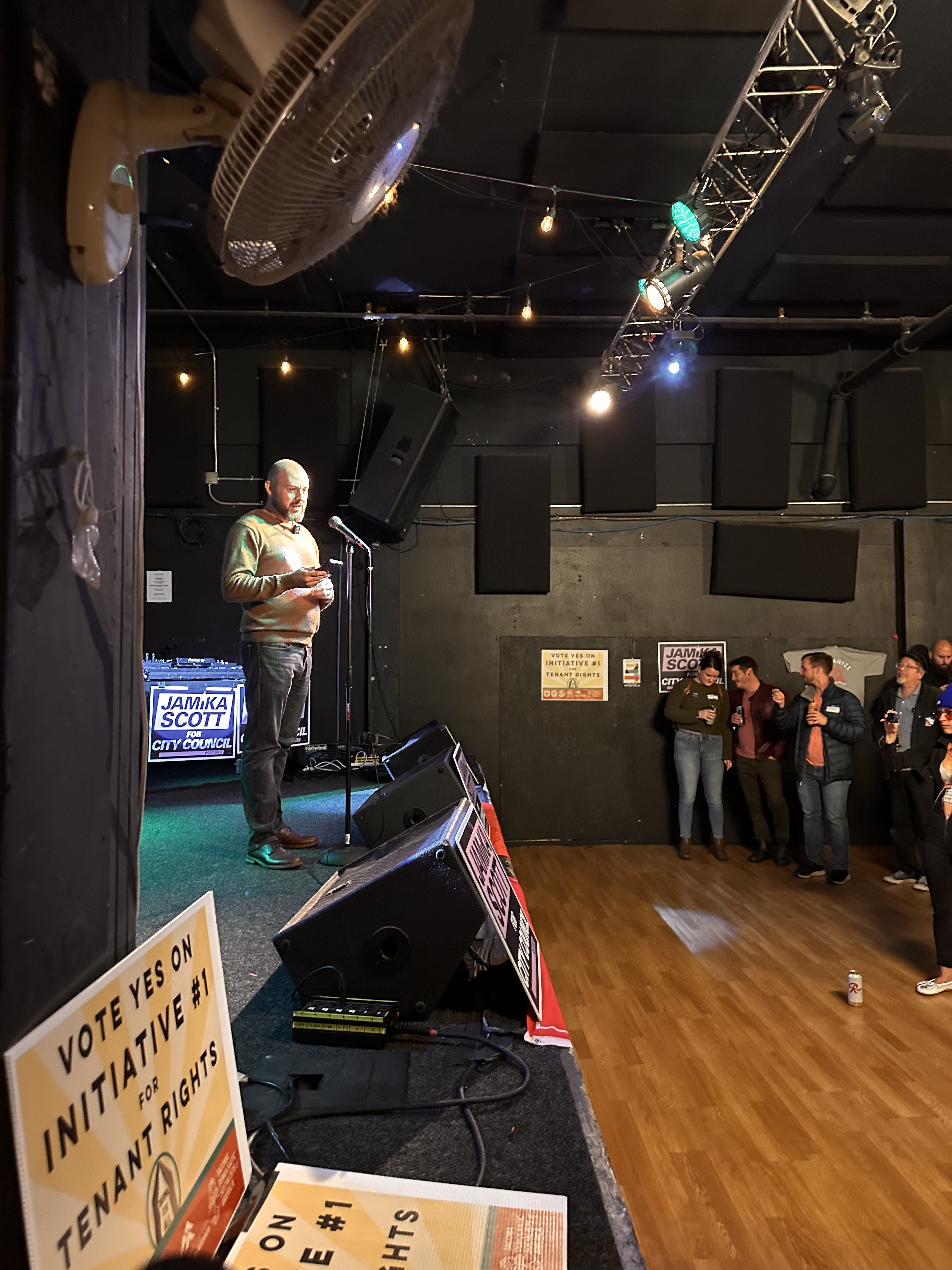 Tacoma For All Campaign Manager Ty Moore kept the mood upbeat as the first round of election results came in Tuesday night. (Credit: Lauren Gallup / NWPB)