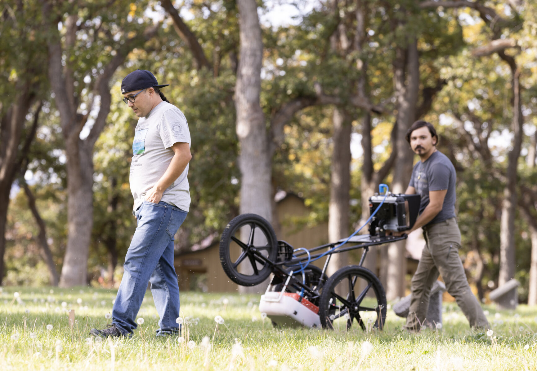 Shane Turntoes-Kuhnhenn, right, and Jon Olney Shellenberger search an area where Native American boarding school dormitories used to be with ground-penetrating radar at Mool-Mool, or Fort Simcoe Historical State Park, in White Swan, Wash. 