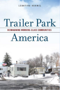 Trailer Park America: Re-imagining Working Class Communities is printed on a book cover featuring a snowy trailer park with white mobile homes. 