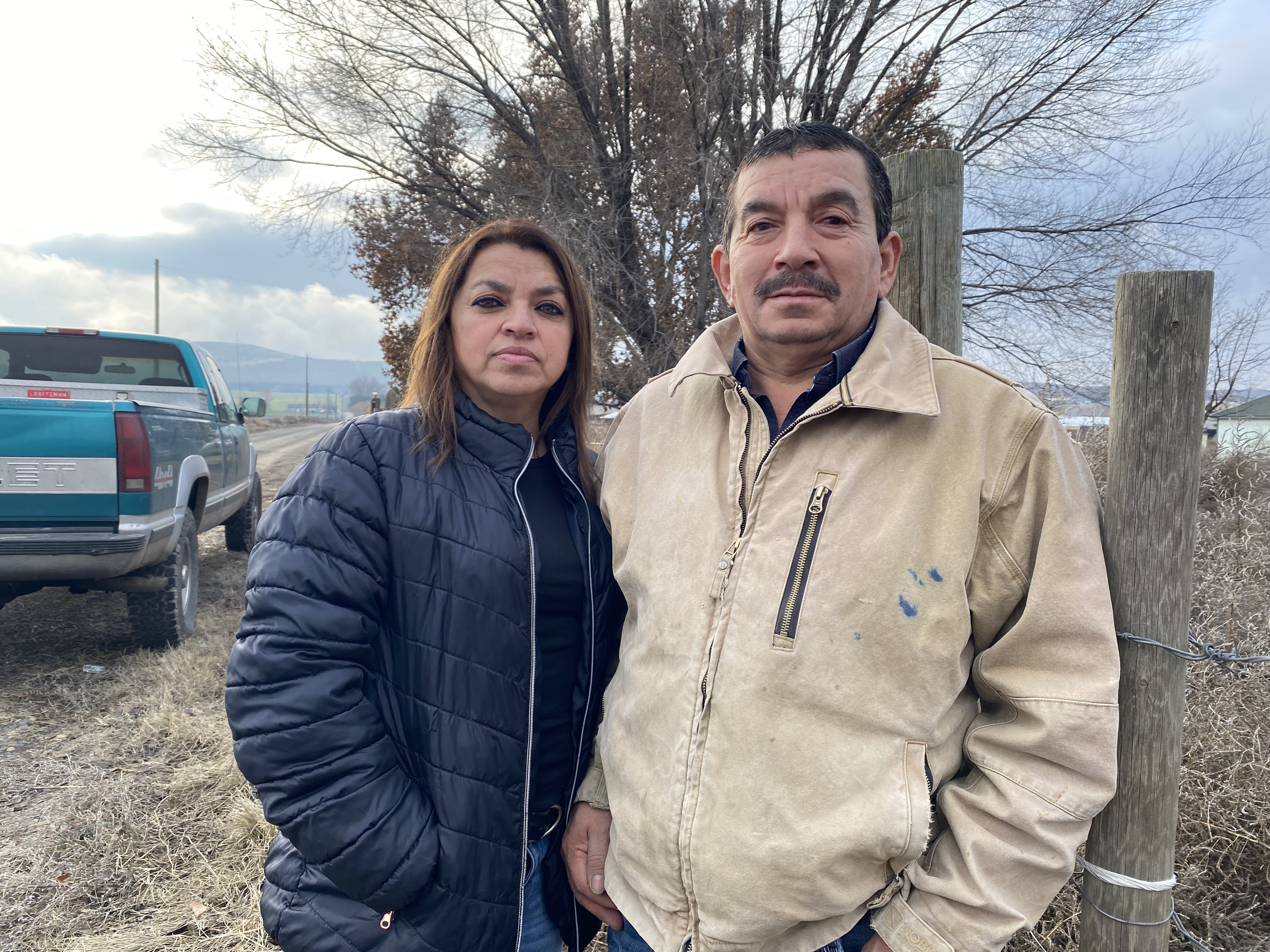 Sergio Madrigal and his wife, Rosa, stand outside the farm they owned, until recently, near Sunnyside, Washington.