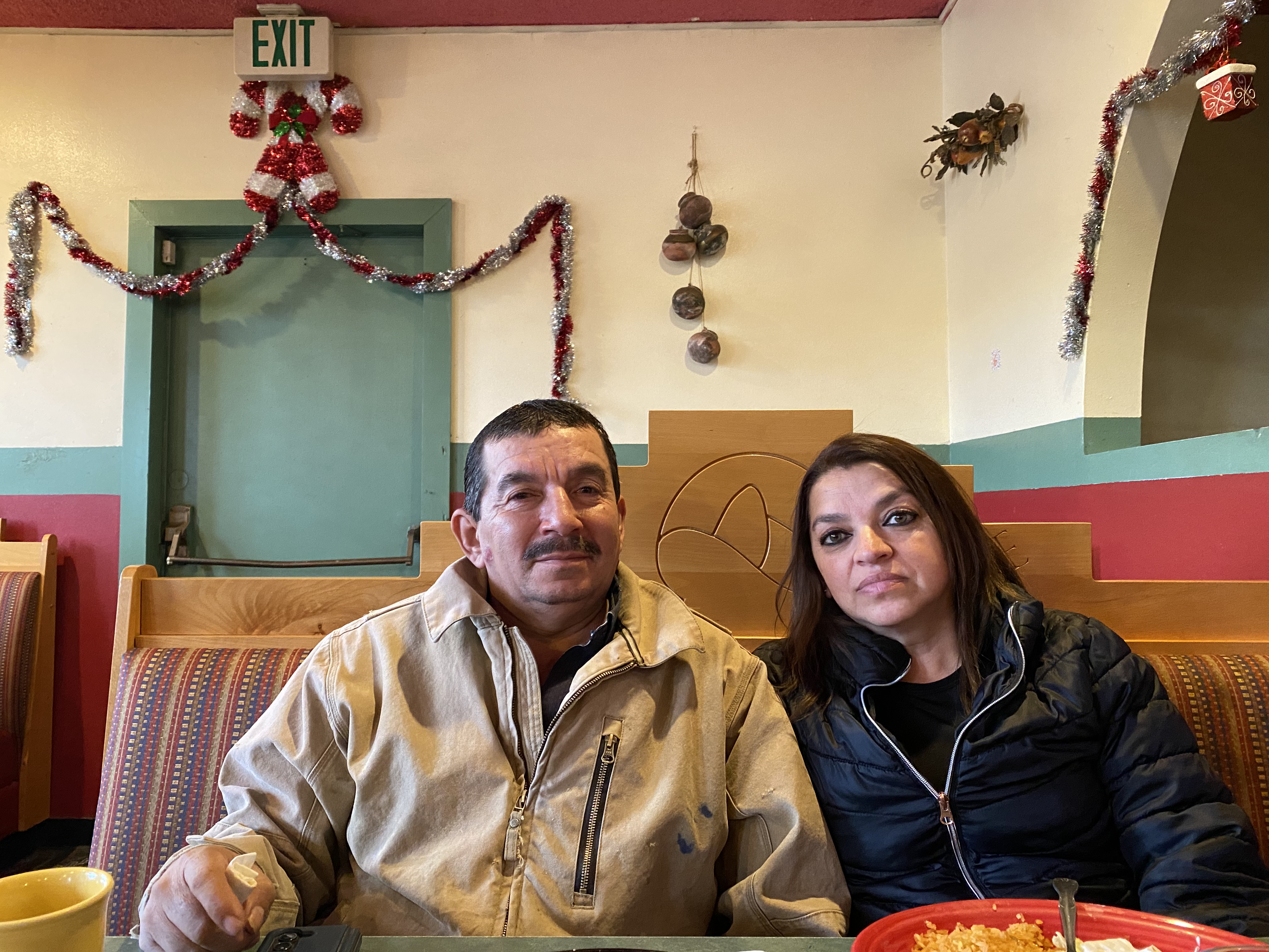 Sergio Madrigal and his wife, Rosa, sit at El Valle Family Mexican Restaurant in Sunnyside, eating fajitas under Christmas tinsel, although they weren’t feeling festive