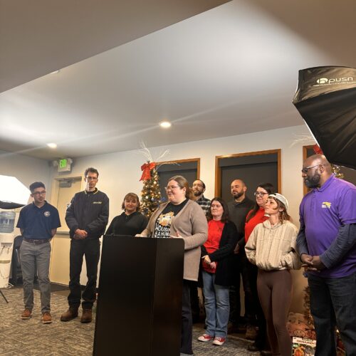 Tacoma labor leaders celebrate the passage of Citizens’ Initiative Measure No. 1 at a press conference on Friday, Dec. 8. (Credit: Lauren Gallup / NWPB)