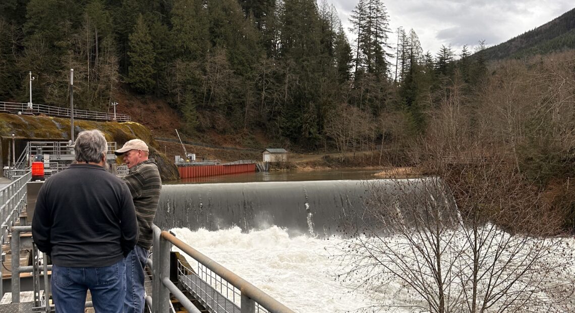 Tacoma Water employees walk alongside the Green River Dam. Most of Tacomans' water comes from this source. (Credit: Lauren Gallup / NWPB)