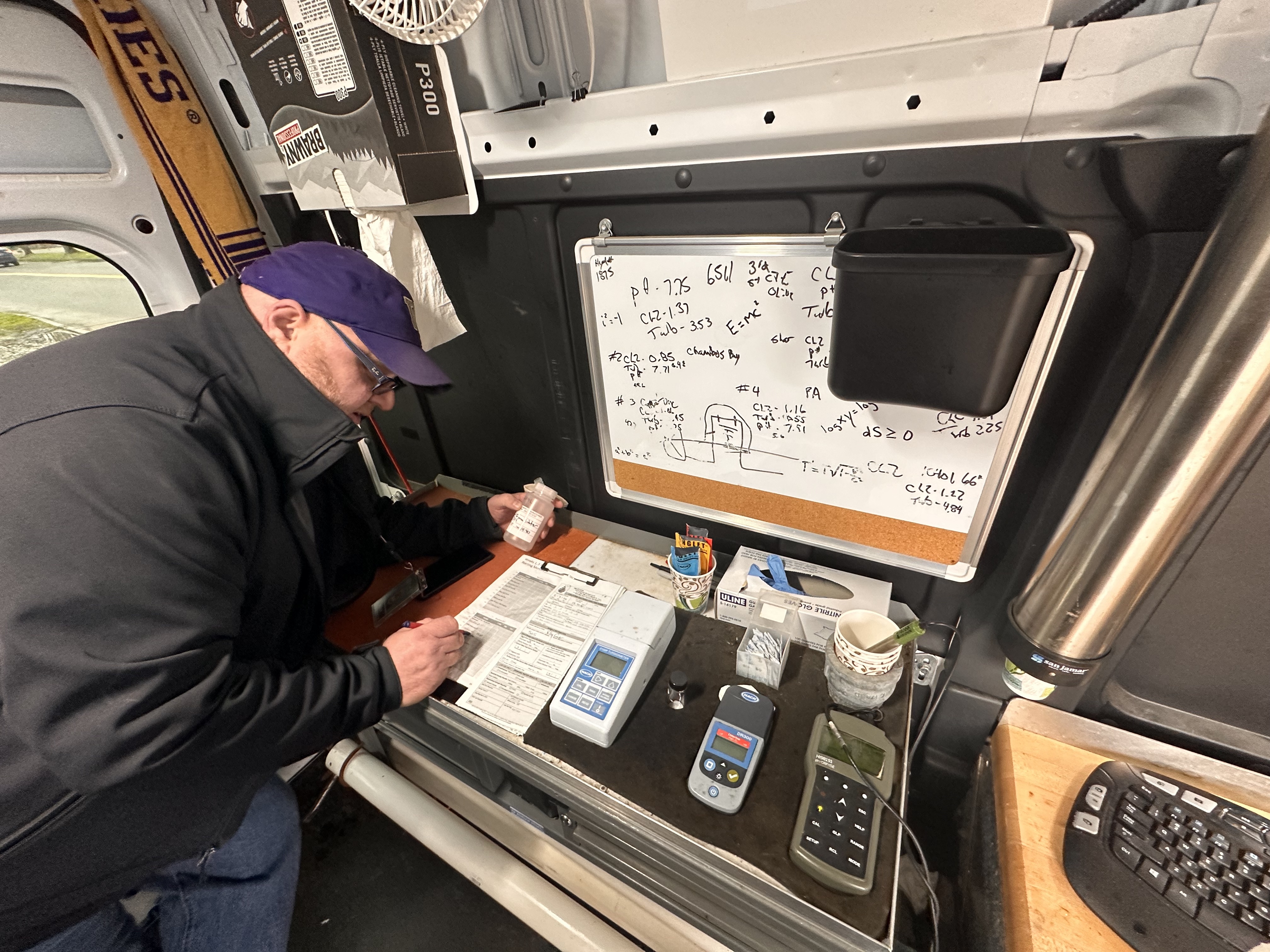 Kelly Cooper prepares to test for chlorine residual and coliform in his Tacoma Water van. (Credit: Lauren Gallup / NWPB)