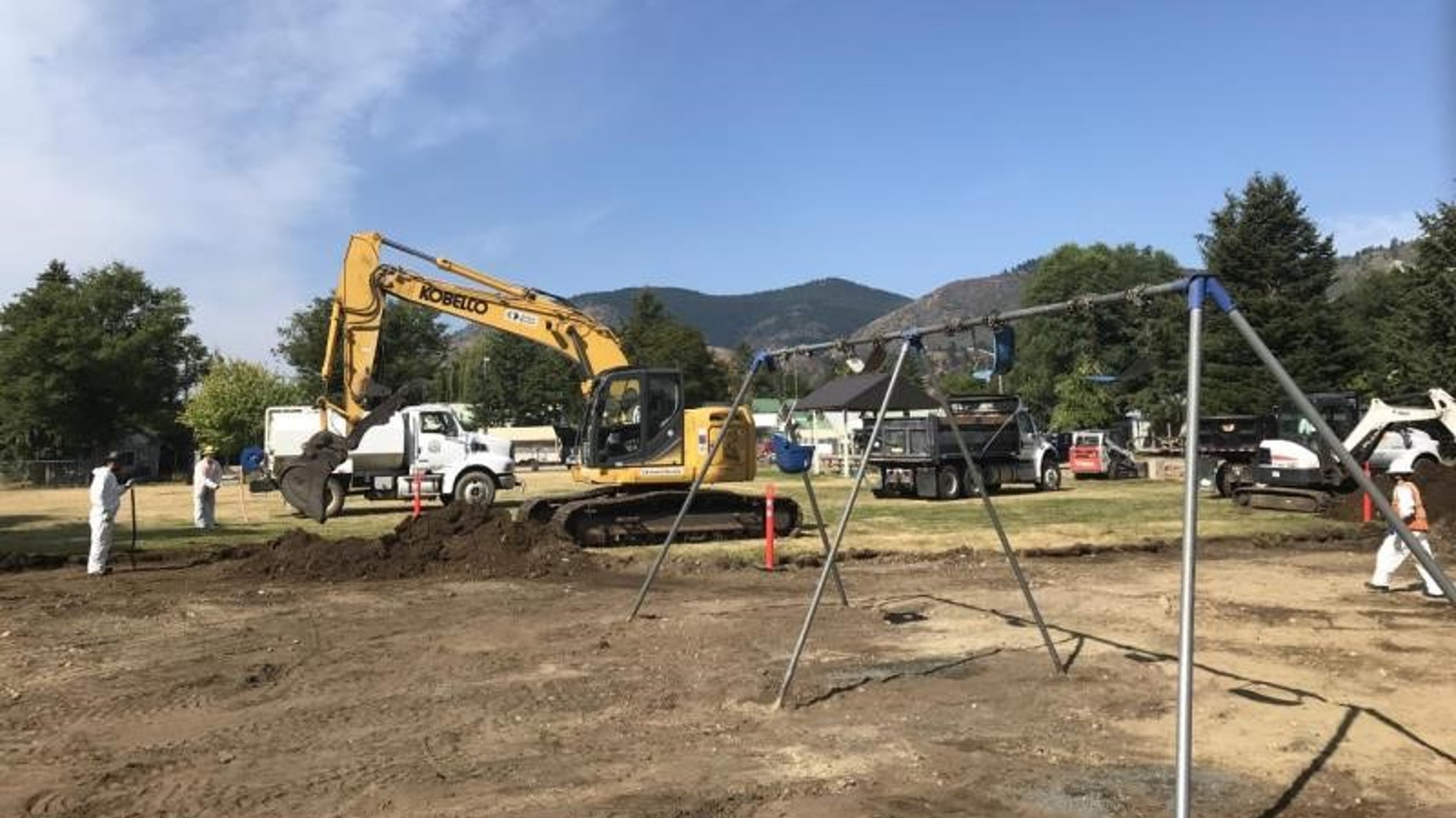 Workers scrape away the top soil at a remediation site at the Lyn Kaste Gould Memorial Park in Northport, Washington in 2020.