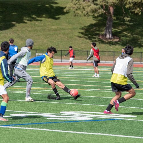 Junior Reyes (center) takes a shot on goal during tryouts for the Tri-Cities Badgers FC semi-pro soccer team March 2 at Fran Rish Stadium in Richland. (Credit: Annie Warren / NWPB)