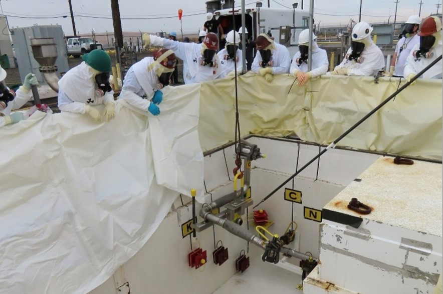 Workers installed waste transfer equipment last year in a valve pit for retrieving waste from single-shell tanks at Hanford in southeast Washington. 