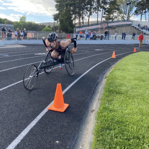 Ben Belino races the mile May 2 at Ephrata High School. The graduate had his left leg amputated after a bad car crash. The student plans to play wheelchair basketball for Eastern Washington University.