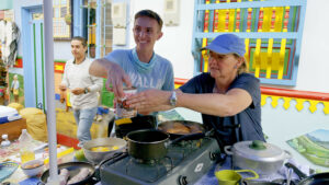 Danny Butler and Angie Butler compete in an Amazing Race challenge while they were in Colombia, Danny's favorite country he visited during the show. (Courtesy of CBS ENTERTAINMENT)